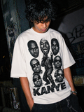 Person wearing a white t-shirt with a graphic of Kanye West and the word 'Kanye' printed on it.