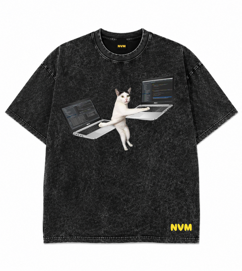 A black acid-wash short-sleeve t-shirt shown from both front and back. The front features a graphic of a white cat sitting at a laptop, and the back is solid black with a small yellow 'NVM' logo near the bottom hem.