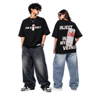 Two people wearing black t-shirts with bold text and graphics on a white background